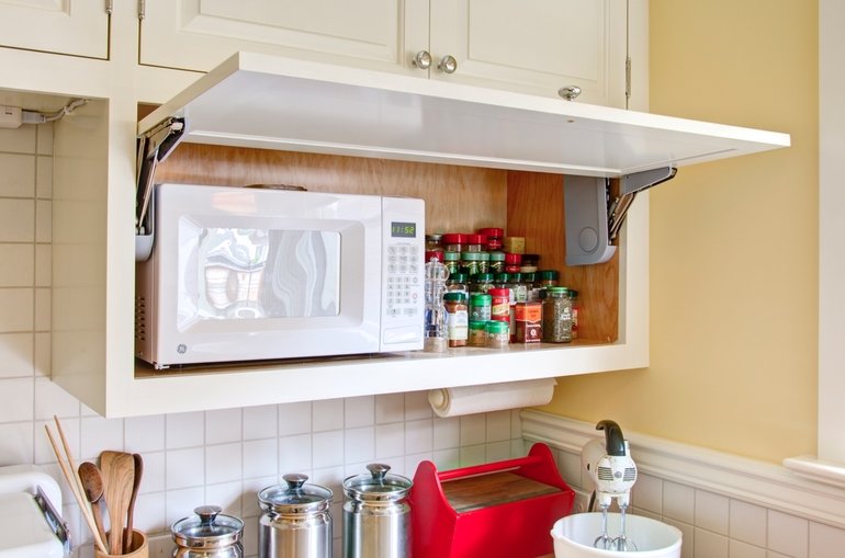 How to place a microwave in a cupboard